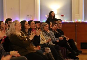 The Ceremonial Mayor of Salford Ann-Marie Humphreys sat in the audience clapping after a poetry reading.