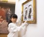 7-year-olds winning artwork will sit next to the work of Lowry