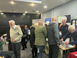 People gathered around the stalls at Salford History Festival