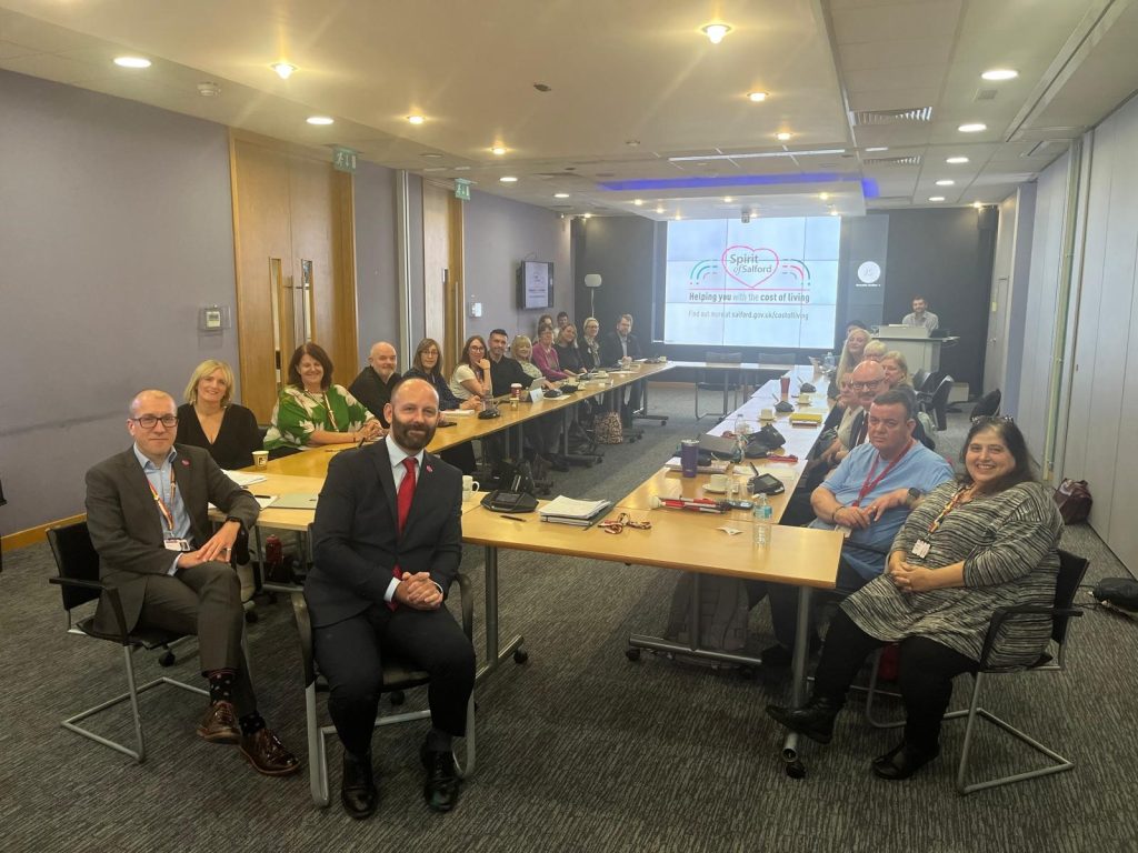 Photo of Paul Dennett and councillors discussing pension credits. Taken by Andrew Brunt