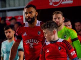 Curtis Tilt leading Salford City out at the Peninsula Stadium