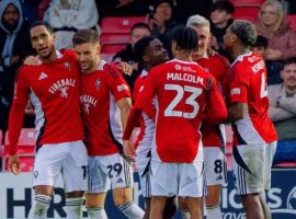 Salford celebrate as they advance in the FA Cup - Salford City