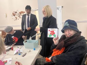 Rebecca Long Bailey shown the christmas cards by Care home residents - HC One 