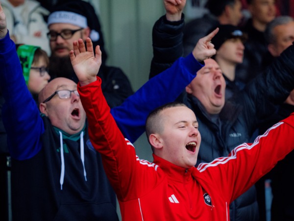 Salford City fans celebrate boxing day win over Barrow