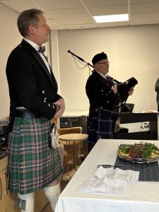 Col (Ret’d) Russ Miller recites the address to the haggis