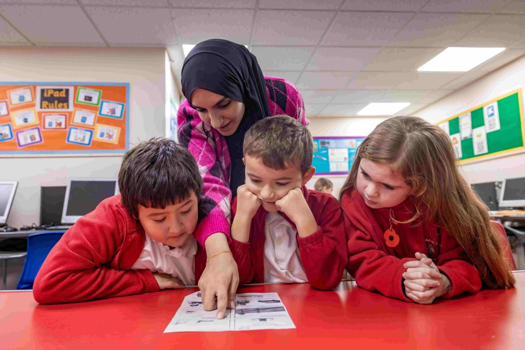 University of Salford Tutor Trust helper supporting Year 5 pupils in Salford Credit: Tutor Trust