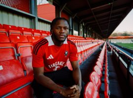 Salford City have completed the signing of versatile wing-back Rosaire Longelo from Swindon Town.