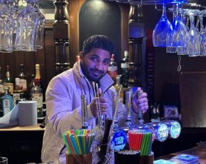 Vinay Mandava behind the bar of The Kings Head 