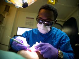 MEDITERRANEAN SEA (July 18, 2016) Hospitalman Andre Parrish cleans the teeth of a patient aboard the amphibious assault ship USS Wasp (LHD 1) July 18, 2016.
More:
Wasp is deployed with the Wasp Amphibious Ready Group to support maritime security operations and theater security cooperation efforts in the U.S. 6th Fleet area of operations. Original public domain image from Flickr