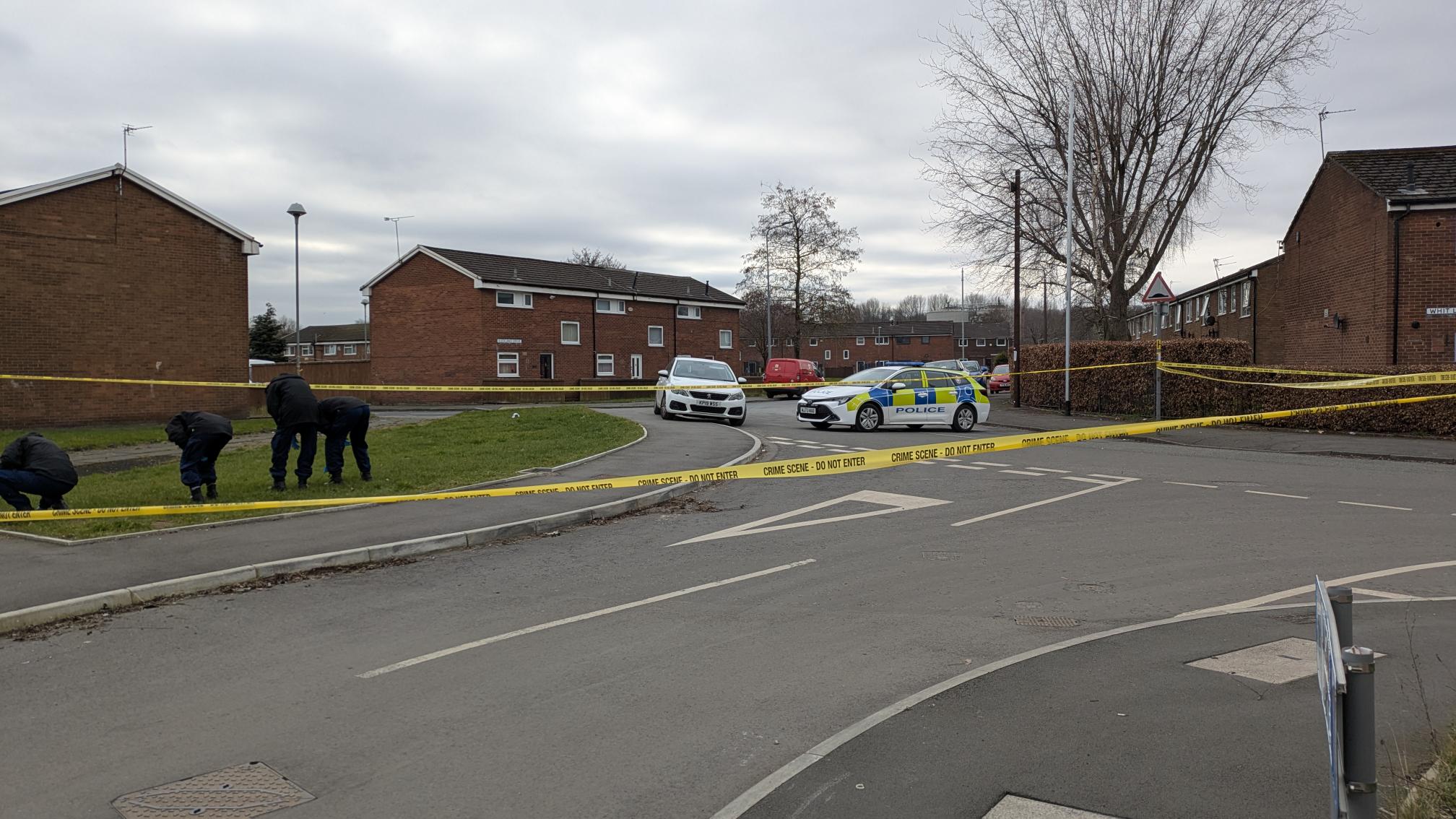 Police cordon off Salford street following reports of a firearms discharge