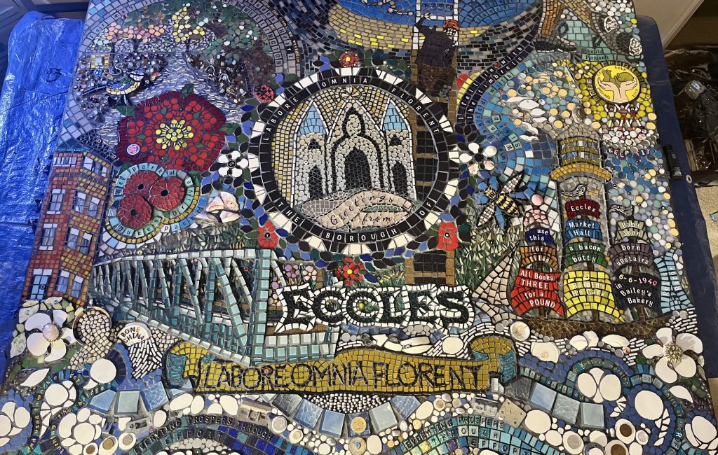 A large-art project. We Love Eccles is being delivered on hoardings around the town centre in the summer as regeneration work progresses