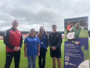 Paul Trainor, from Salford Red Devils Foundation, Kate Burns Salford Manbassadors Project Lead at Salix Homes, Loki Carter from Salix Homes, and Nathan Connell, Super League player
