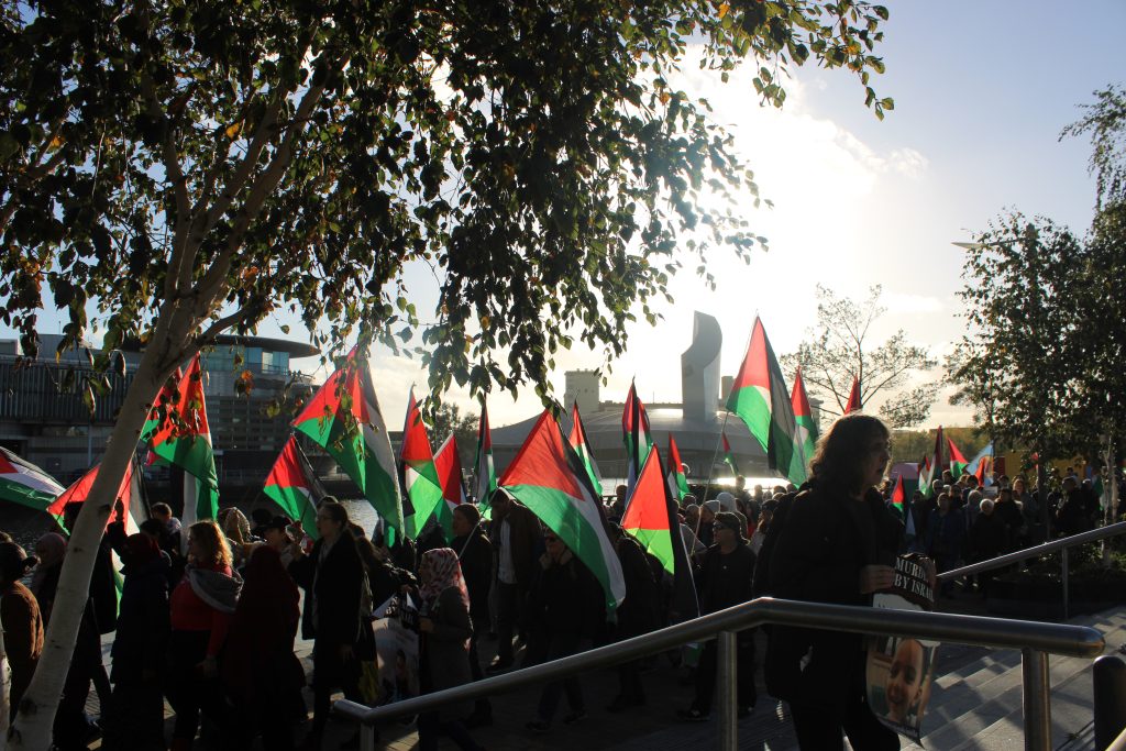 Pro-Palestine protestors marching through Media City