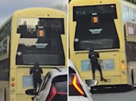 Boy rides on back of Salford bus