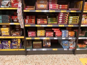 Hidden - The Eccles Cakes sit on the bottom shelf in their hometown